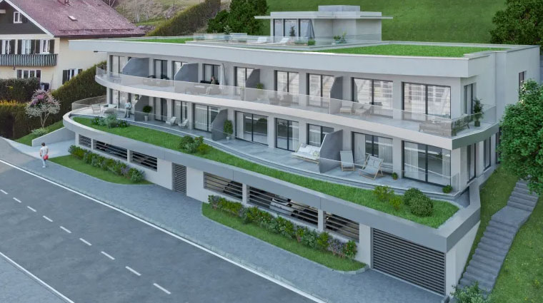 Mehrparteienhauses mit großzügigen Balkonen, graue Fassade und Tiefgarage.