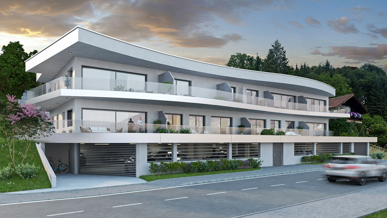 Mehrparteienhauses mit großzügigen Balkonen, graue Fassade und Tiefgarage.